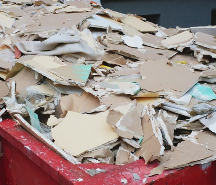 Pile Of Hazardous Construction Materials Waste In Large Metal Garbage